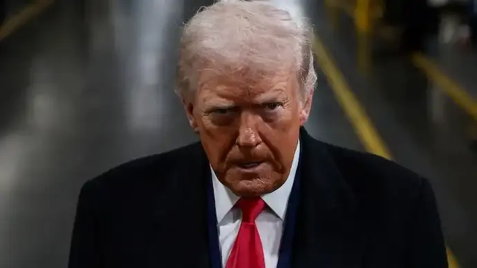 Video Shows Trump Making Obscene Gesture at Heckler During Michigan Factory Tour