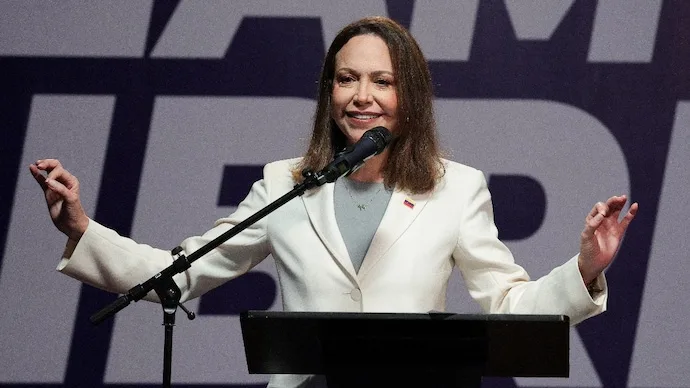Maria Corina Machado addresses the press in Caracas after returning to Venezuela in October 2026.