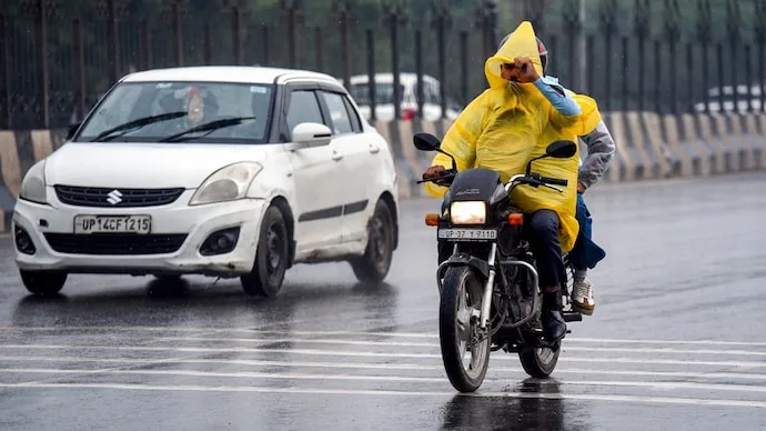 Rain-soaked roads in Delhi-NCR following overnight showers and a drop in temperatures.