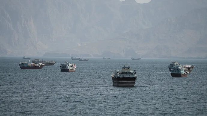 Vessels sailing through the Strait of Hormuz amid heightened maritime tensions