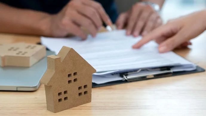 Homebuyer reviewing property and home loan documents during the festive season