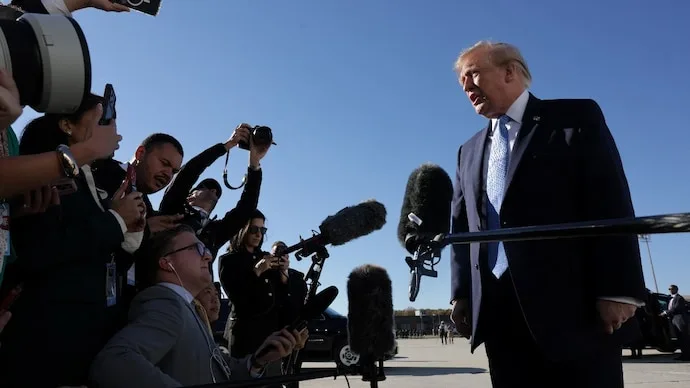 US President Donald Trump speaks to reporters before boarding Air Force One amid election fraud allegations.