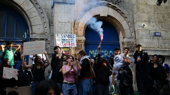French high school students protest outside a school in Paris during nationwide demonstrations