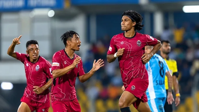 Churchill Brothers players celebrate during their 2-1 Indian Super League victory over Mumbai City FC at Fatorda.