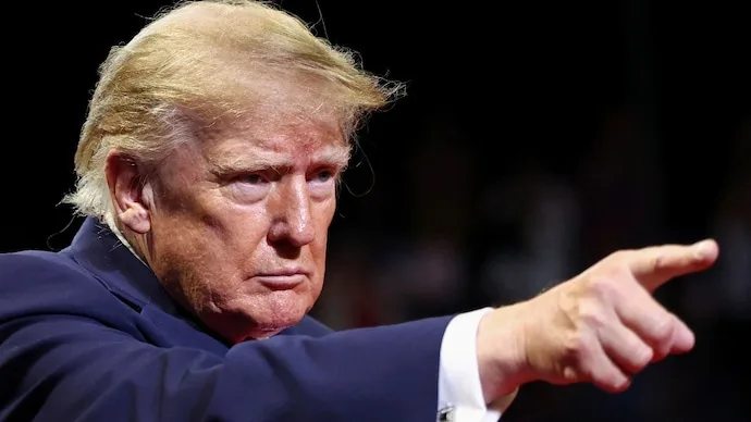 Donald Trump warns of possible renewed US military action against Iran amid threats to Gulf undersea internet cables.