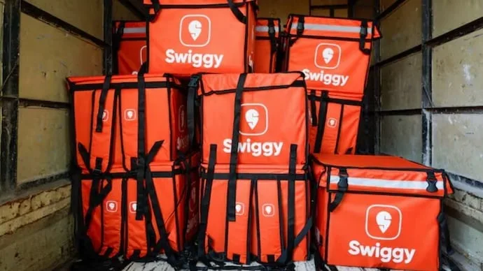 Swiggy shares fall to a record low amid rising Instamart losses and quick-commerce competition.