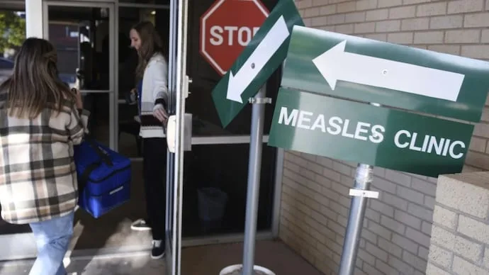 Children and health workers during a measles vaccination campaign