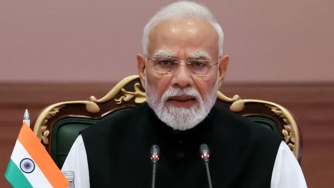Prime Minister Narendra Modi speaking about poverty reduction and citizen empowerment at the Bloomberg New Economy Forum in New Delhi.